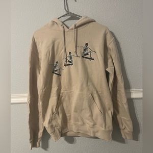 Beige skeleton hoodie. Size small.